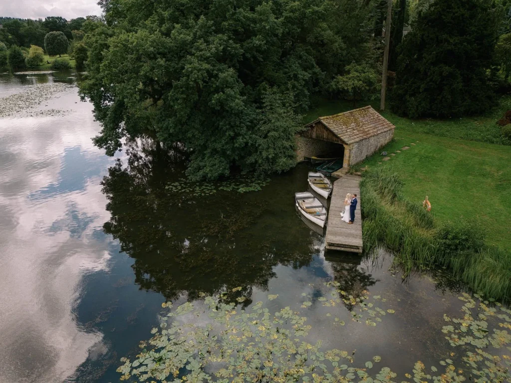 drone photograph of bride and groom on a jetty by the lake at Coniston Hotel. north yorkshire wedding photographer
