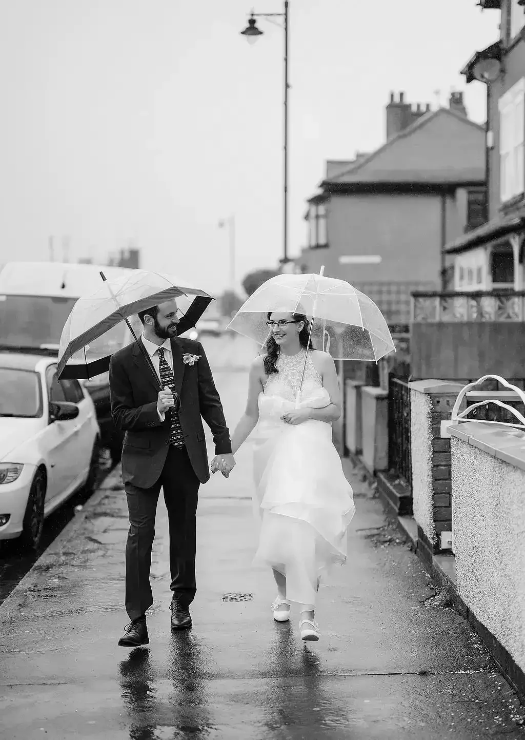FileybriggweddingEleopmentphotographerbrideandgroomwalkingintherainwithumbrellasintehrain001