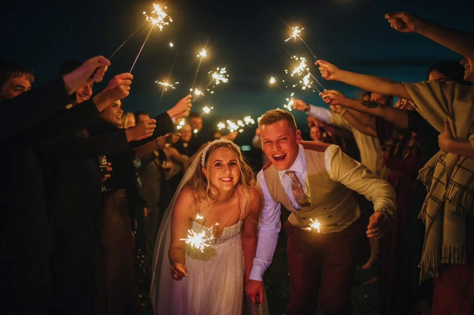 Bride and groom during sparkler exit at Little Wold Vineyard, photographed by a Yorkshire wedding photographer.