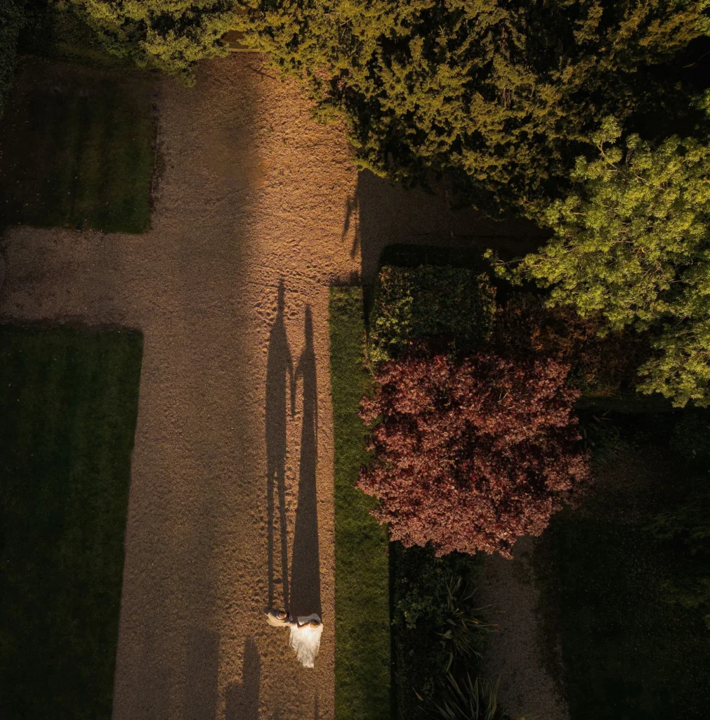 bawtry hall wedding photographer bride and groom at sunset by drone. long beautoful shadows, creating a love heart