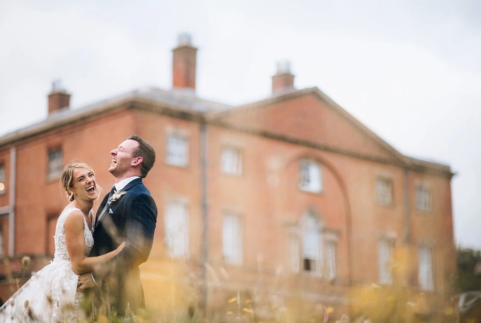 bride and groom laughing and hugging at norwood park taken by yorkshire wedding photographer
