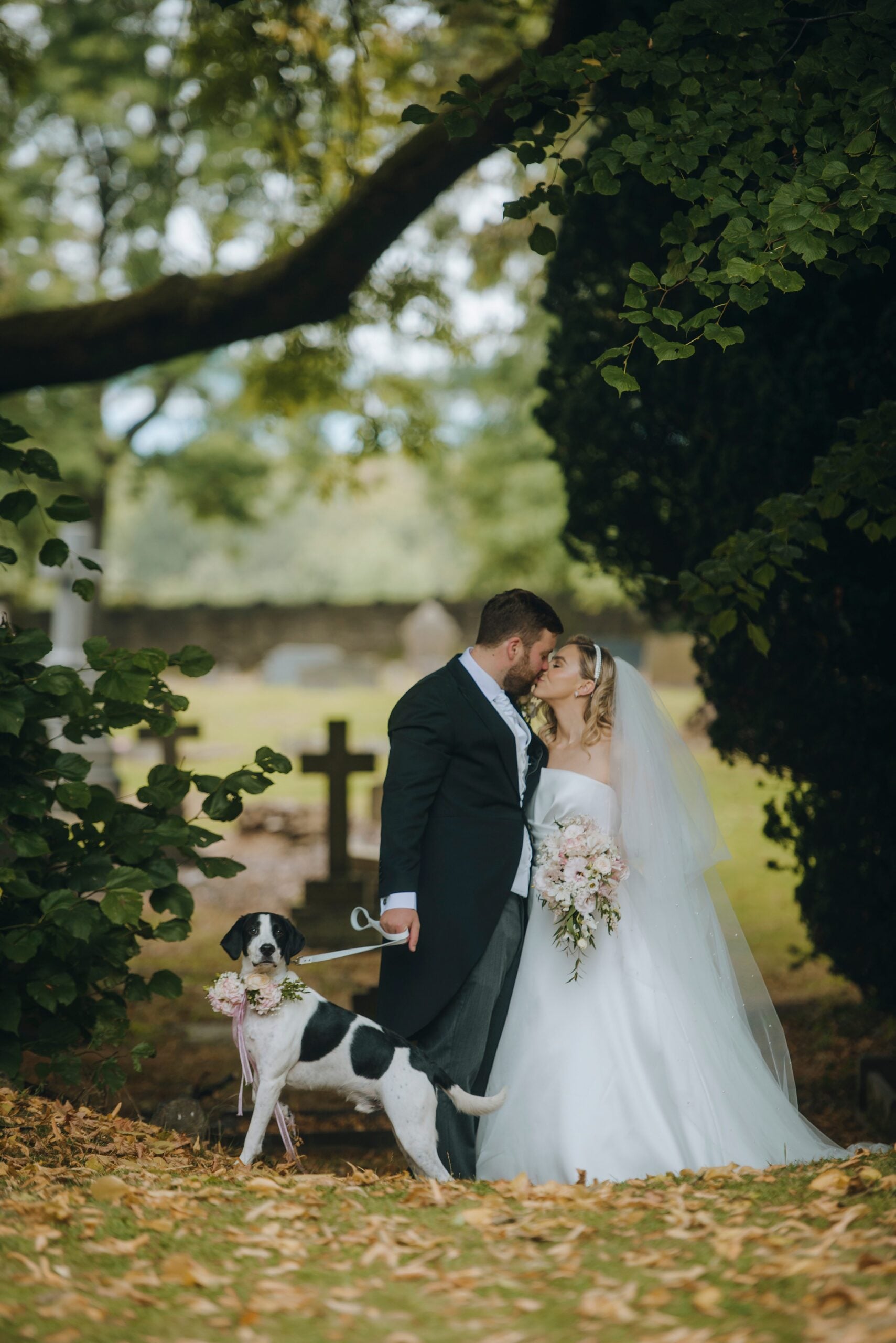 Bride getting ready with her dog resting nearby before a Yorkshire wedding