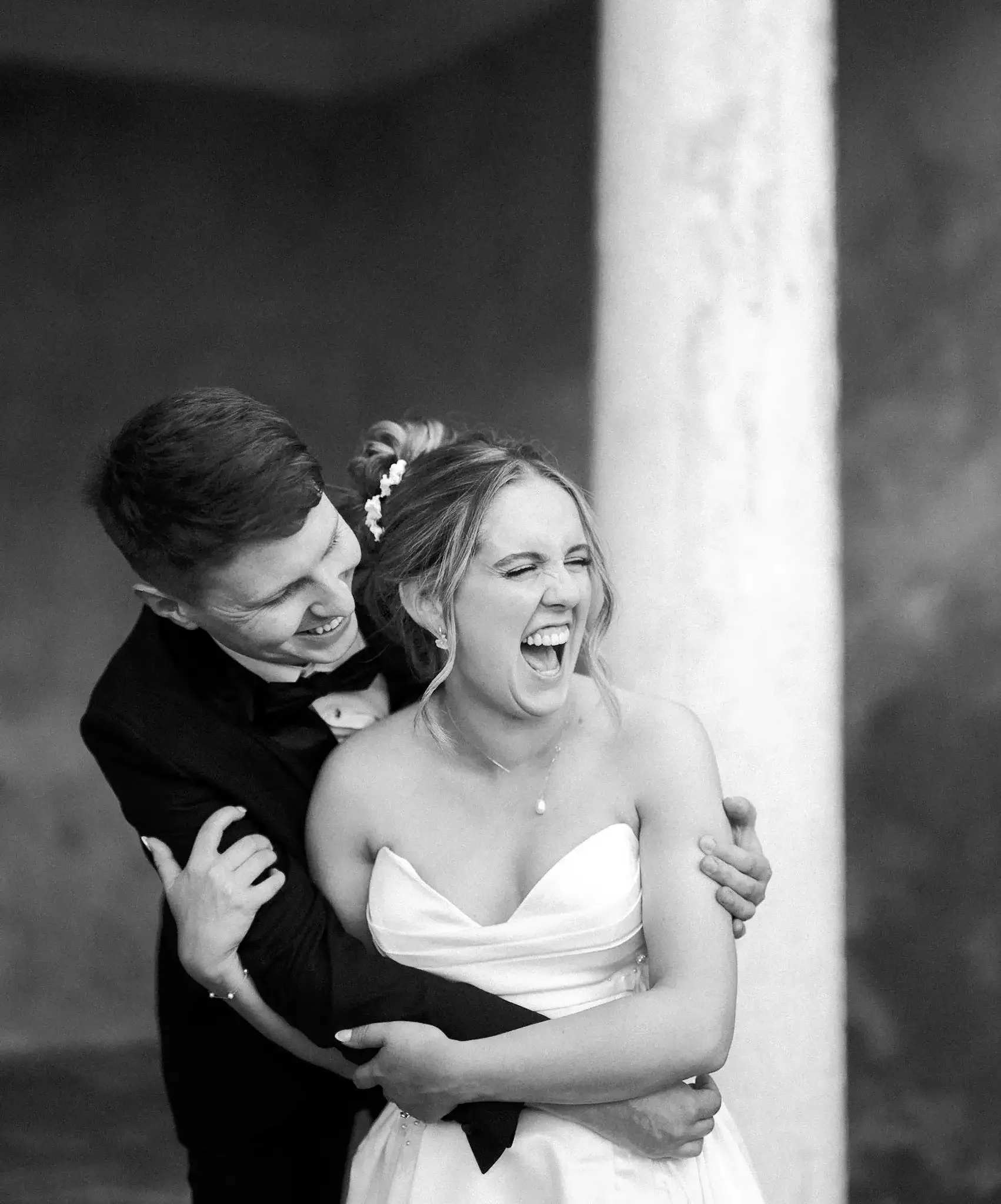 Bride and groom laughing at Norwood Park, Southwell