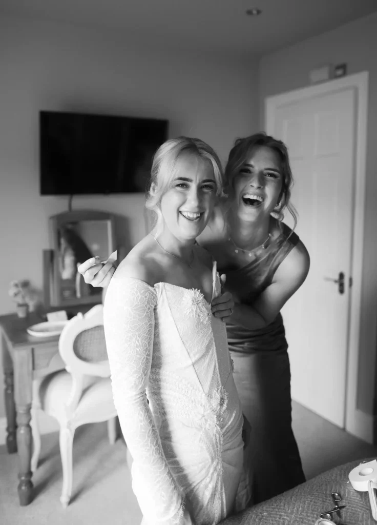 bridal preparations bride and groom laughing Low Osgoodby Grange Wedding Photographer