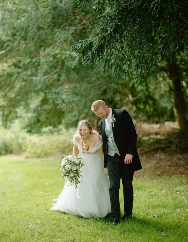bride adn groom laughing at wortley hall taken by yorkshire portraits