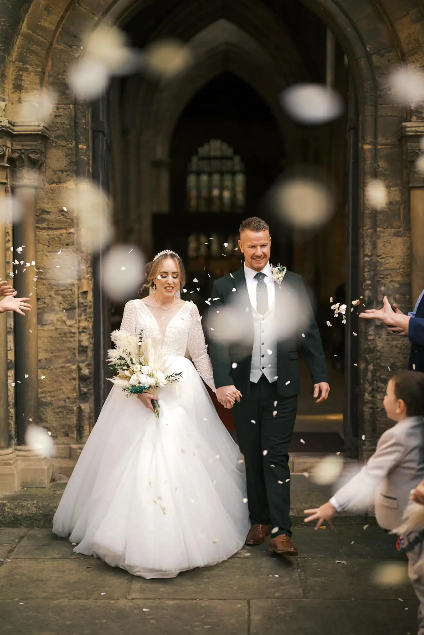 confetti thrown at hbride adn groom leaving hatfield church doncater by yorkshire wedding photographer