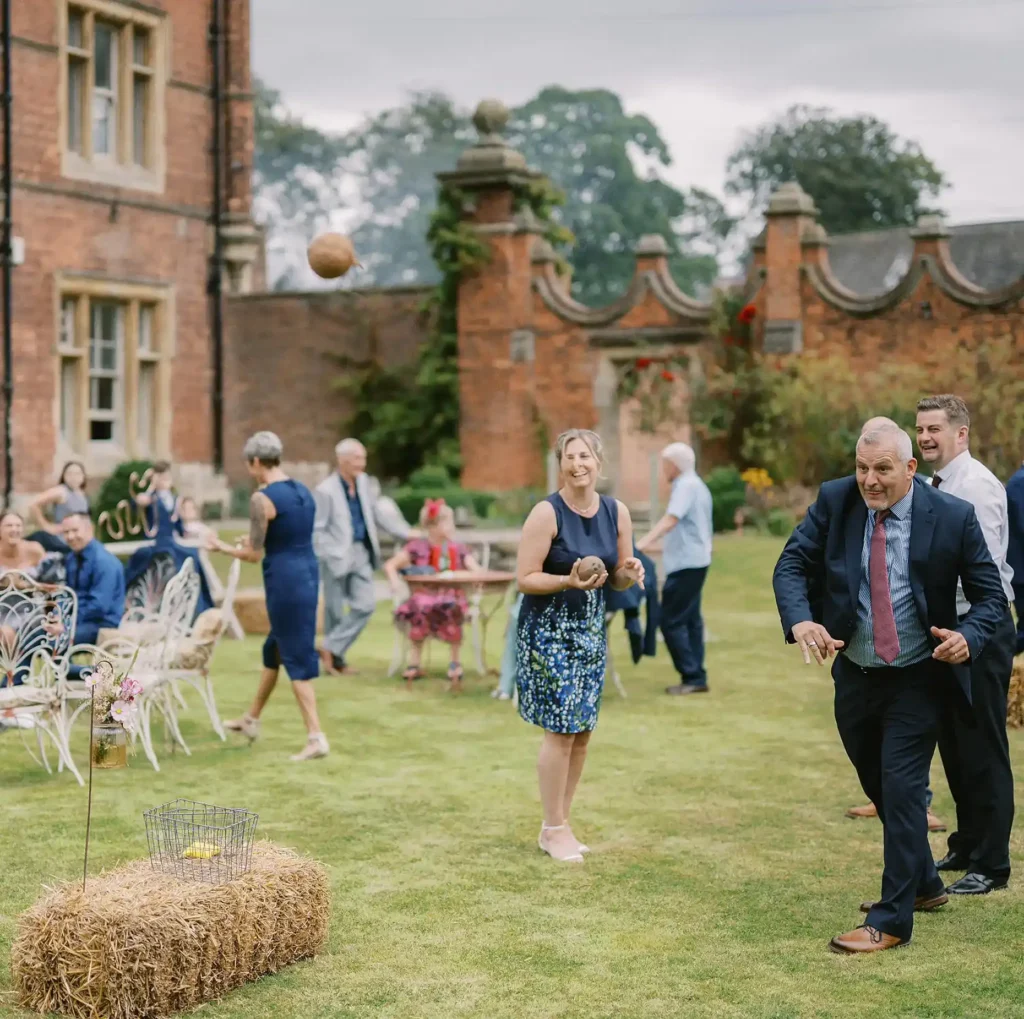 coconut toss in gardens of rossington hall by yorkshire portraits wedding photographer