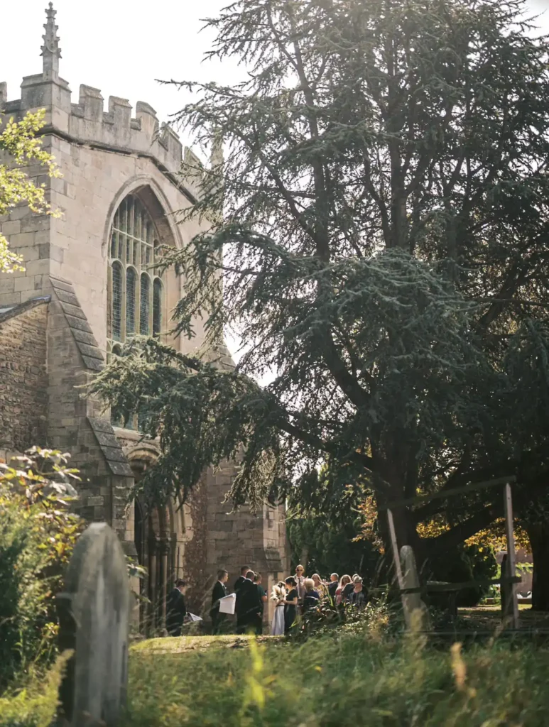 wedding guests outside hatfield church doncaster taken by yorkshire wedding photographer