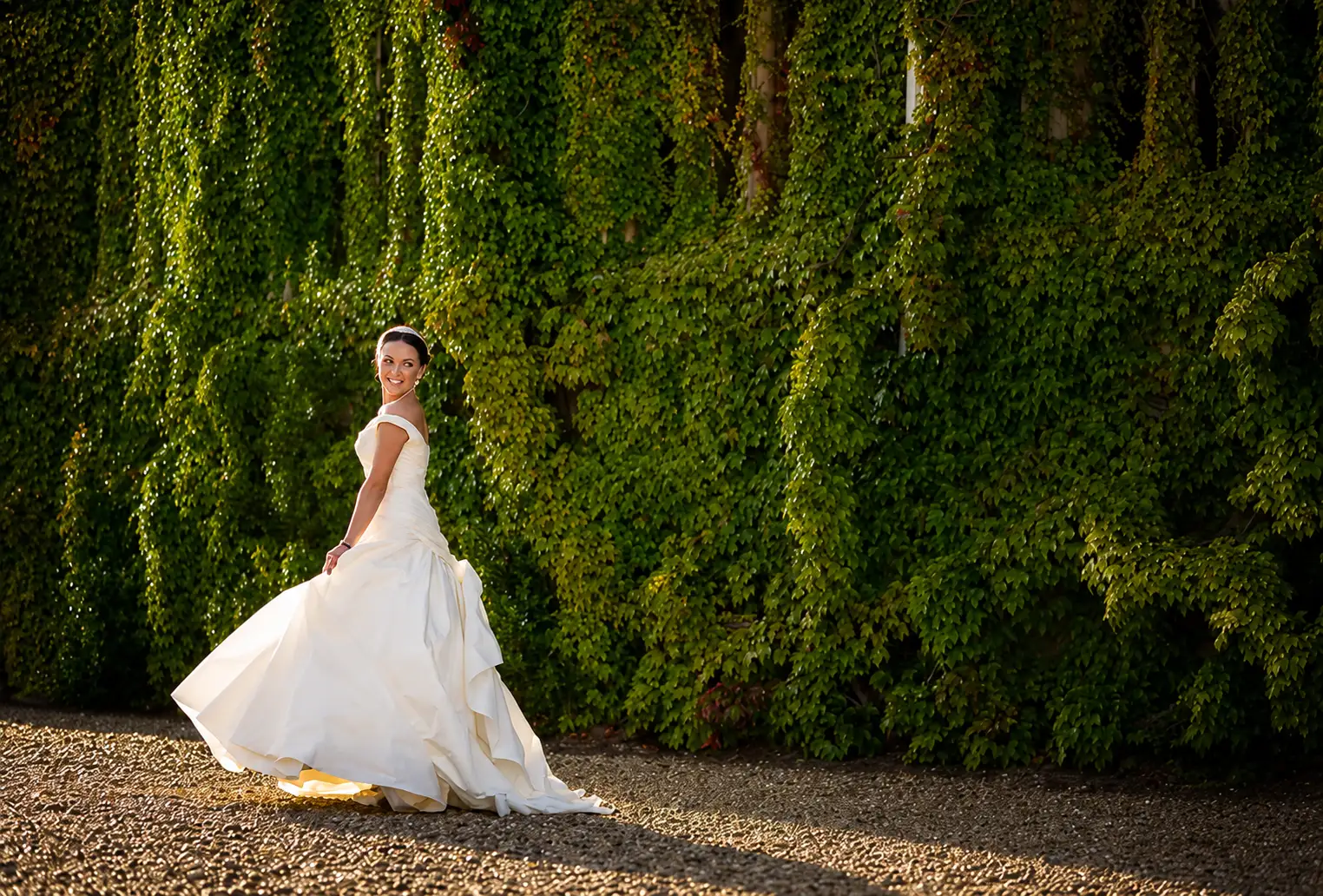Carlton Towers wedding photographer, bride smiling in white wedding dress in sunshine
