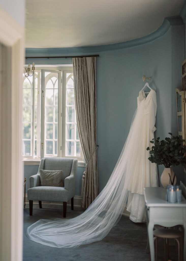 cockcliffe country house wedding photographer bridal gown hanging in bridal suite