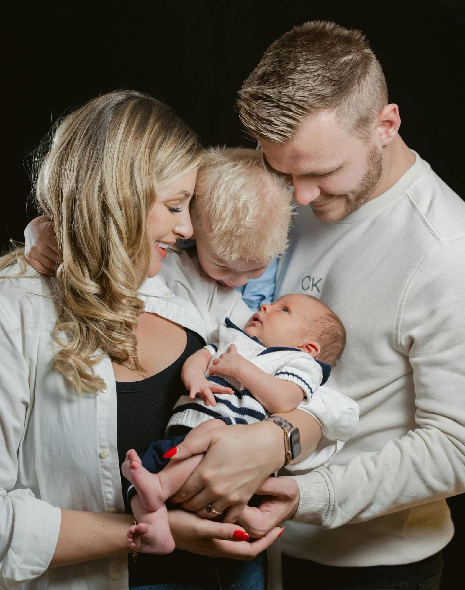 Mum, dad and big brother Theo gathered around newborn baby Archie